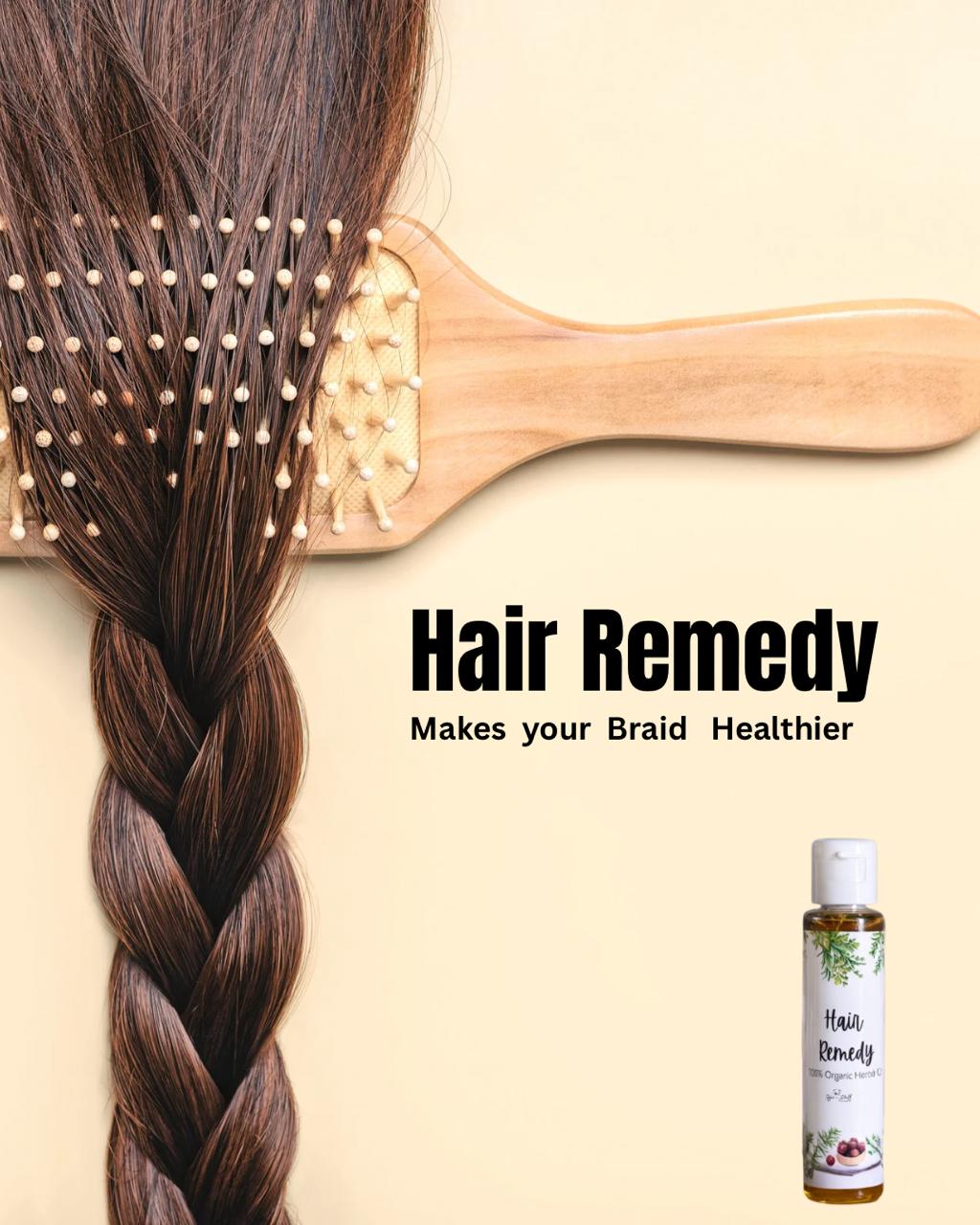 Braided hair with a wooden comb and a bottle of 'Hair Remedy' on a beige background.